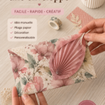 Un tapis de travail avec des enveloppes colorées faites à la main et des outils de papercraft